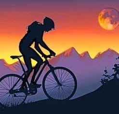 Mountain Biker On Step Hills At Sunset