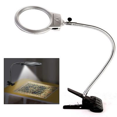 Adjustable magnifying lamps